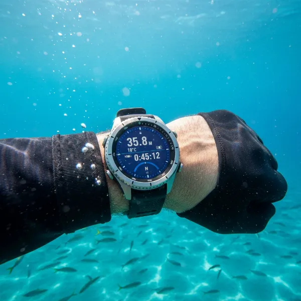 Diver checking advanced smartwatch underwater, displaying depth and water temperature.