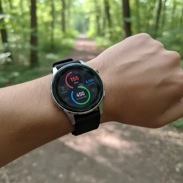 Google Pixel Watch 4 tracking heart rate and workout data on a user's wrist